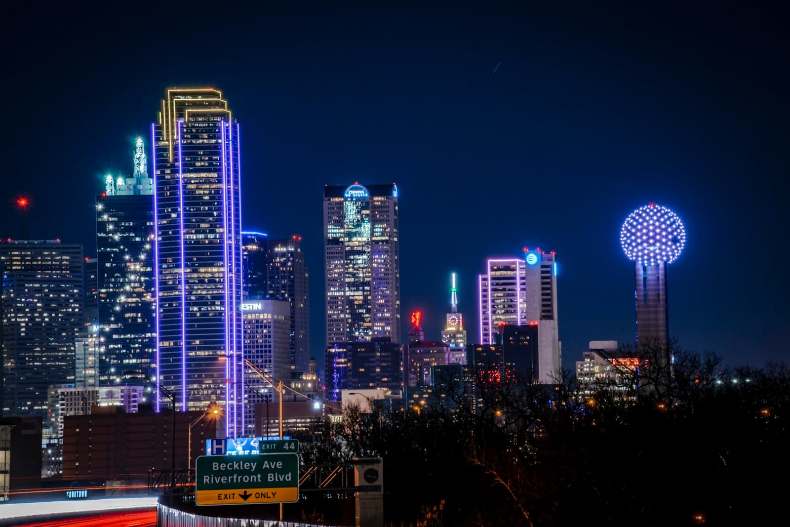 Dallas skyline at night with Reunion Tower lit in blue