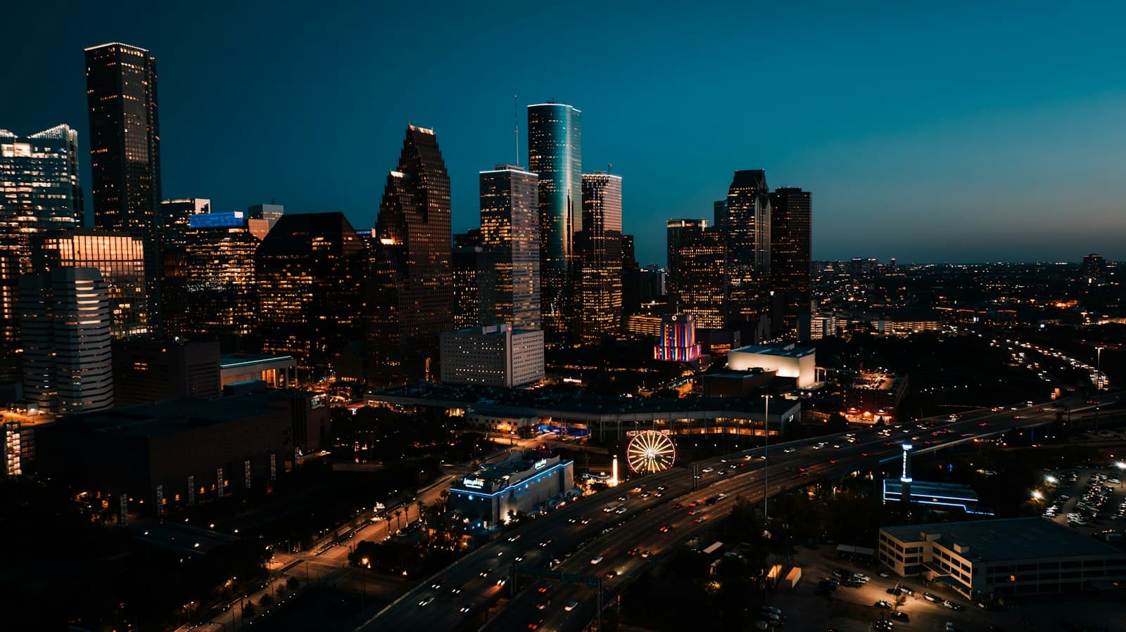 Downtown Houston skyline and freeways lit up at night